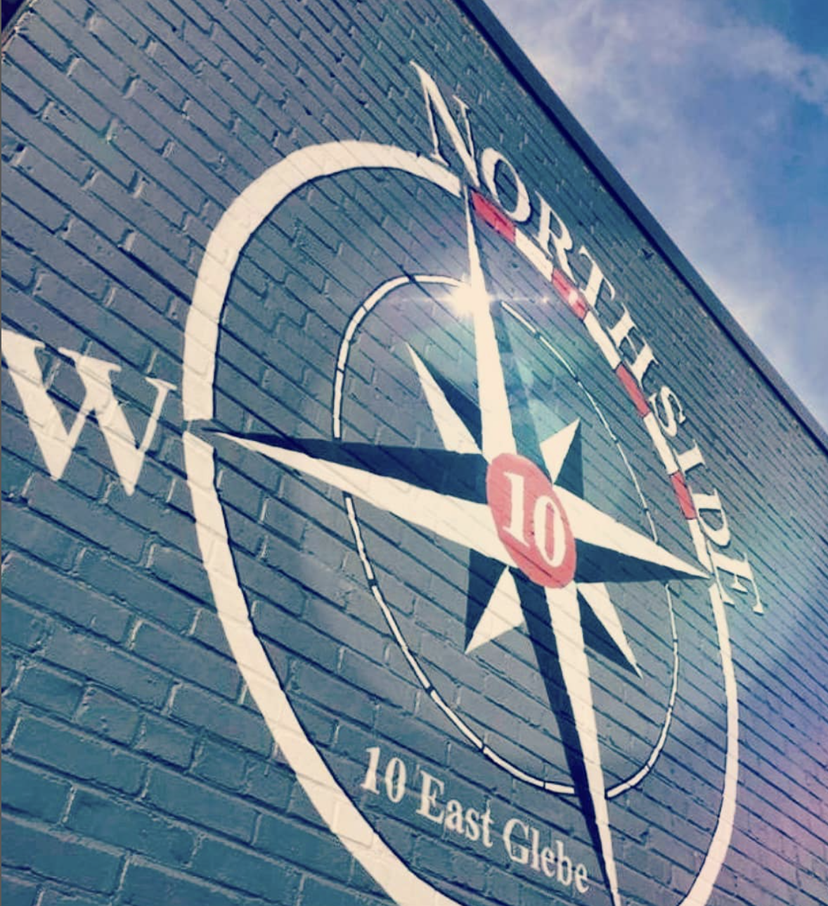 Northside 10 logo on brick wall